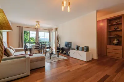 a living room with a couch and a table at Freitas House by Homie in Ponta do Sol