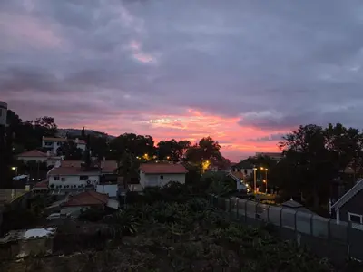 a view of a city at night with a sunset at Sunrise View in Funchal