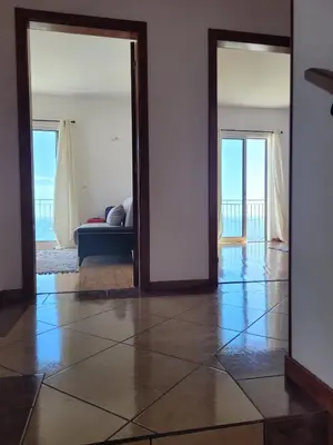 a living room with a view of the ocean at Maison avec vue exceptionnelle sur l'océan - 5 mn du centre ville in Santa Cruz