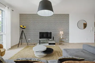 a living room with a couch and a tv at Sunny House by Homie in Canhas