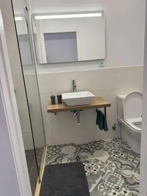 a bathroom with a sink and a toilet at C - Charming Vacation home with FREE Private Parking in Machico