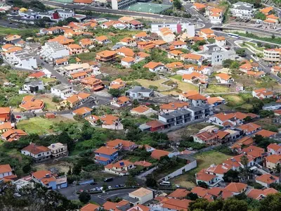 an aerial view of a town with houses at C - Charming Vacation home with FREE Private Parking in Machico