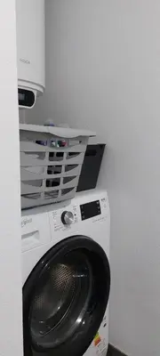 a washer and dryer in a room at Seven in Funchal