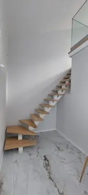 a staircase in a room with a white wall at Seven in Funchal