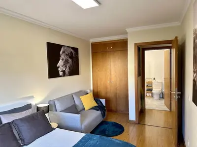 a living room with a bed and a couch at SUPER Anadia - Turquesa in Funchal