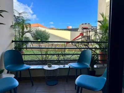 a balcony with chairs and a table and a view at SUPER Anadia - Turquesa in Funchal