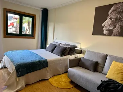 a bedroom with a bed and a couch at SUPER Anadia - Turquesa in Funchal