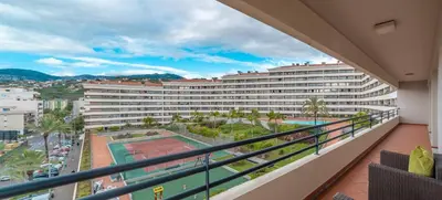 a balcony with a view of a large hotel at Monumental Palace in Funchal