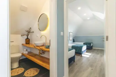 a bathroom with a sink and a toilet in a room at Casa da Horta by Atlantic Holiday in Santa Cruz