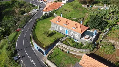 an aerial view of a house on a hill with a road at Casa da Horta by Atlantic Holiday in Santa Cruz