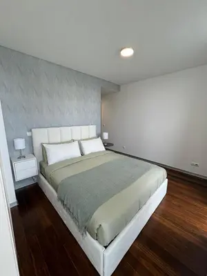 a bedroom with a large bed in a room at Funchal Next Corner Plaza in Funchal