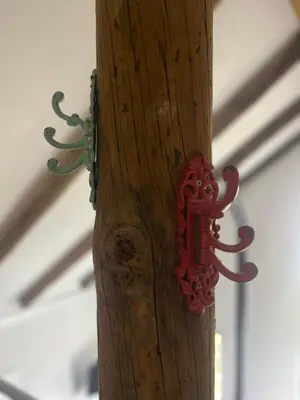 a wooden pole with a red object attached to it at Lucky Lemons - Boutique Houses Madeira - 2 in Estreito da Calheta