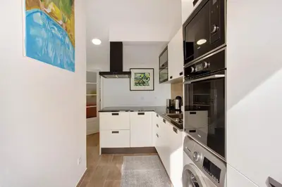 a living room with a couch and a table at Casa Do Lenhador in Canhas