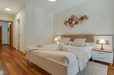 a bedroom with two beds with towels on them at Lido Charm by Atlantic Holiday in Funchal