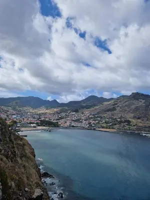a view of a large body of water with a city at E - Elegant Terraced Home with FREE Private Parking in Machico