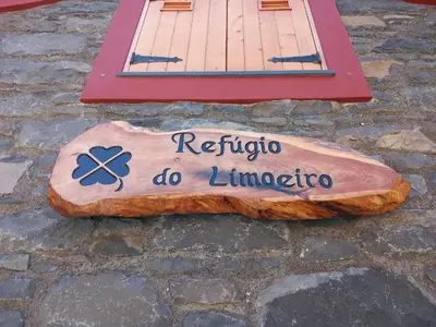 a sign that says refiopolis do limpopo on a stone ground at Refúgio do Limoeiro in São Vicente