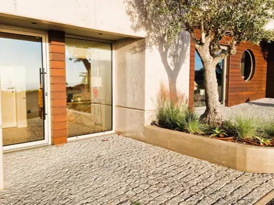 a house with a tree in front of a door at SHELL LIVING - Infinity Loft in Funchal