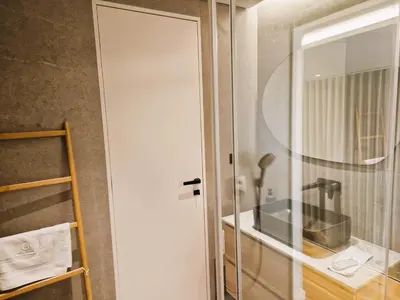 a glass door in a kitchen with a sink at SHELL LIVING - Infinity Loft in Funchal