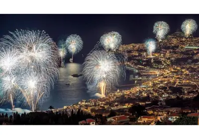 a fireworks display over a city at night at SHELL LIVING - Infinity Loft in Funchal