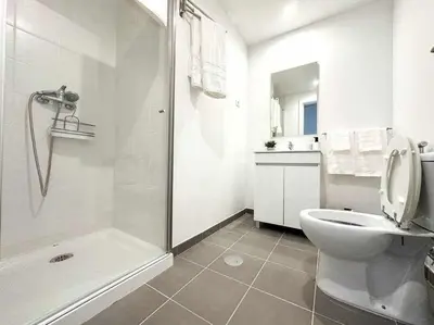 a white bathroom with a toilet and a shower at Pena Apartments - A by MTH in Funchal