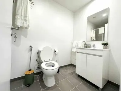 a white bathroom with a toilet and a sink at Pena Apartments - A by MTH in Funchal