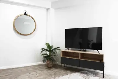 a living room with a tv and a mirror at Pena Apartments - A by MTH in Funchal