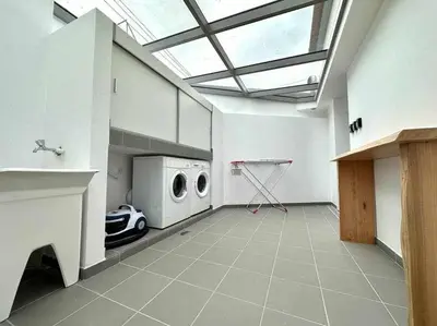 a large room with a garage with a washing machine at Pena Apartments - C by Mth in Funchal