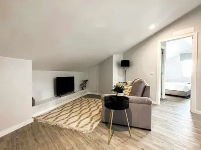 a living room with a couch and a television at Pena Apartments - C by Mth in Funchal
