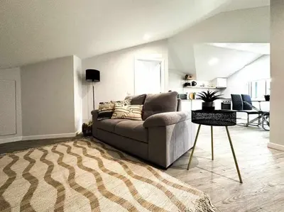 a living room with a couch and a rug at Pena Apartments - C by Mth in Funchal