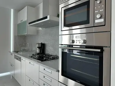 a kitchen with a stove and a microwave at Luxury Apartment in the Center in Funchal