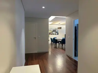 a living room with a table and a dining room at Luxury Apartment in the Center in Funchal