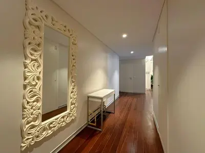 a hallway with a mirror and a dressing table at Luxury Apartment in the Center in Funchal