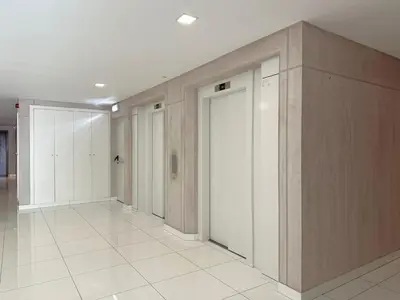 a hallway with white and wooden walls and a door at Luxury Apartment in the Center in Funchal