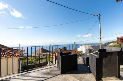 a balcony with a view of the ocean at Casa Barros Serra in Calheta