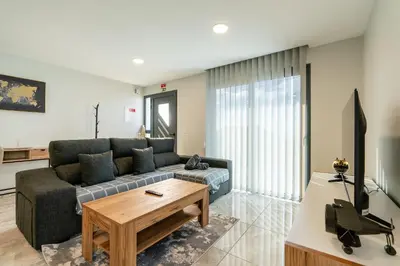 a living room with a couch and a table at Casa Barros Serra in Calheta