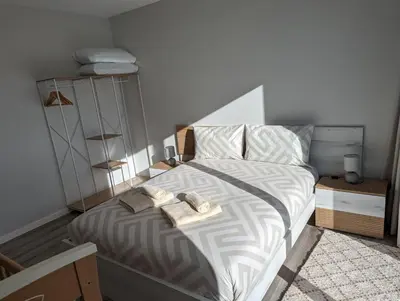 a bedroom with a bed with two towels on it at Casa Barros Serra in Calheta