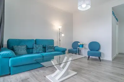 two beds in a hotel room with mirrors at Jardins da Ajuda Apartment in Funchal