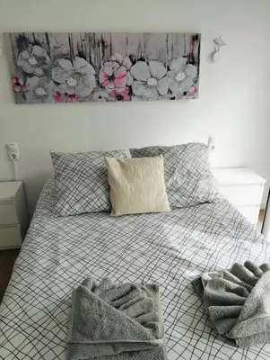a bedroom with a bed with two towels on it at Casa do Mar in Funchal