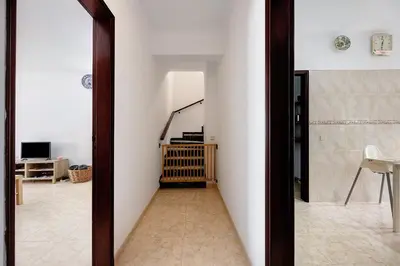 a hallway with a mirror in a room at Casa Brita in Raposeira