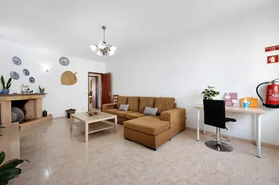 a living room with a couch and a table at Casa Brita in Raposeira