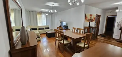 a living room with a table and a dining room at Vista Mar Concórdia by Rentallido in Funchal