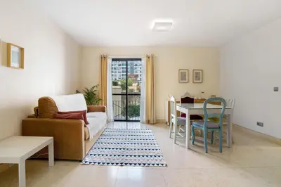 a living room with a couch and a table at Forum T0 Plus in Funchal