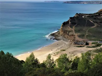 a view of a beach with the ocean at Barranco do Zambujeiro in Vila do Bispo