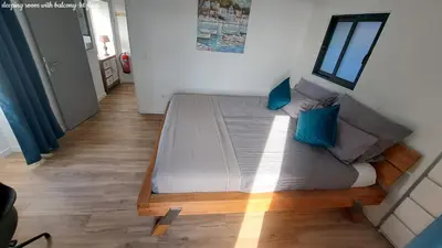 a large bed with blue pillows in a room at Espirito do Mar - Premium Villa with Jacuzzi in Estreito da Calheta