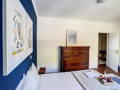 a living room with a couch and a table at Portinho's View by LovelyStay in Caniço