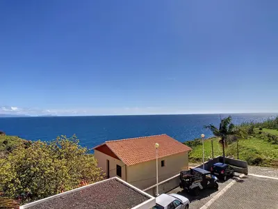 a house with a view of the ocean at Portinho's View by LovelyStay in Caniço