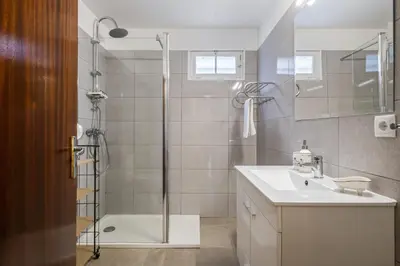 a bathroom with a shower and a sink and a shower at Quinta dos Landeiros - Prosa Verde by Homie in Machico