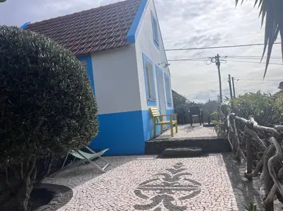 a blue and white house with a painting on it at Lucky Lemons Boutique Houses Madeira 1 in Calheta