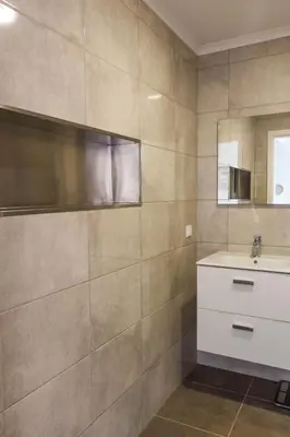 a bathroom with a sink and a mirror at Apartamento Bartolomeu By Horizon View Madeira in Caniço