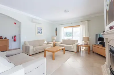 a bedroom with a bed and a large window at Lote 50 at Boavista Resort Lagos in Lagos